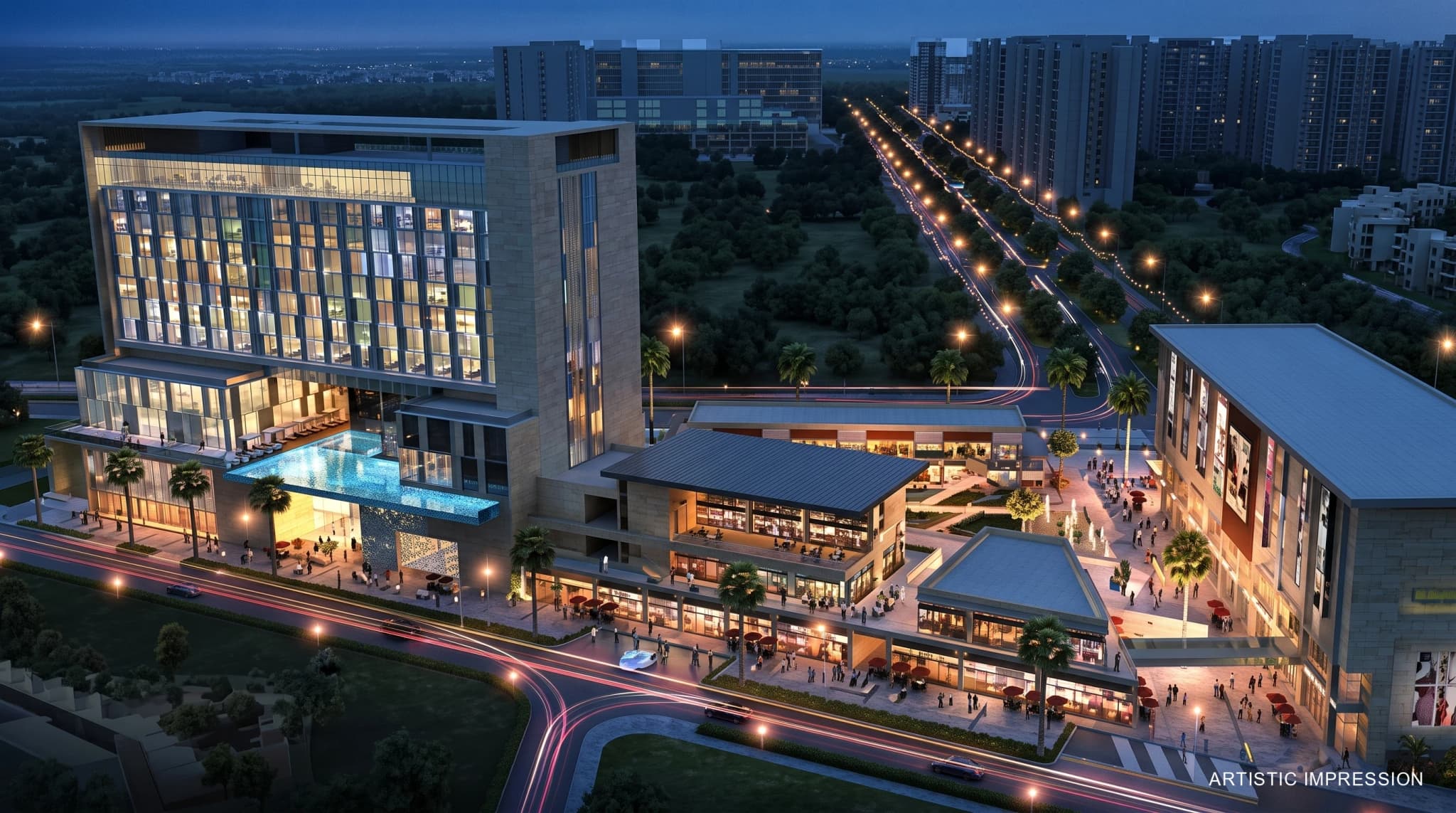 Aerial night view of illuminated clubhouse amenities and surrounding infrastructure at Godrej Nest Sector 150 Noida
